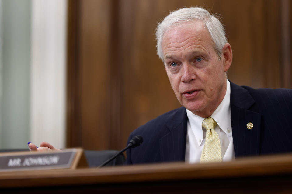 Sen. Ron Johnson speaks at a Senate hearing, his nameplate in front of him.