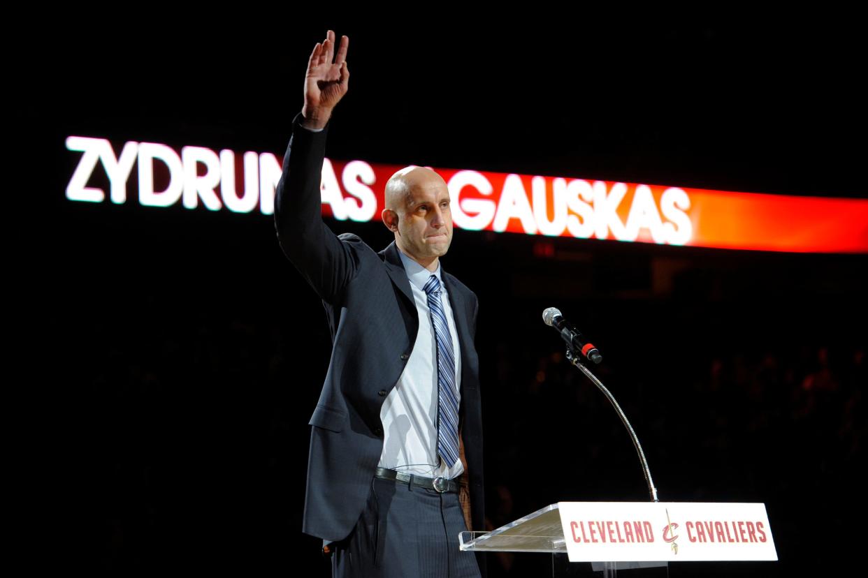 Former Cleveland Cavalier center Zydrunas Ilgauskas waves during his jersey retirement ceremony at Quicken Loans Arena in 2014.