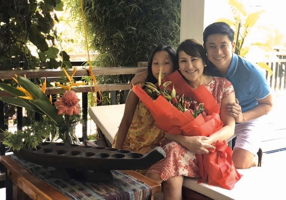 In this August 2019, photo, Carlo Navarro poses with his wife Evie and daughter Gia for a family photo in Lipa, Philippines. When Carlo Navarro, his wife and their 15-year-old daughter visited Japan from the Philippines in February 2020, they knew they were taking a chance with the coronavirus, but thought they would be spared if they took precautions. They wore masks and gloves and always had alcohol handy to sanitize their hands. But the 48-year-old tax lawyer, began showing symptoms after they returned home. Days after he was cleared and discharged from hospital, Navarro shared his COVID-19 experience on a Facebook public post. (Carlo Navarro via AP)