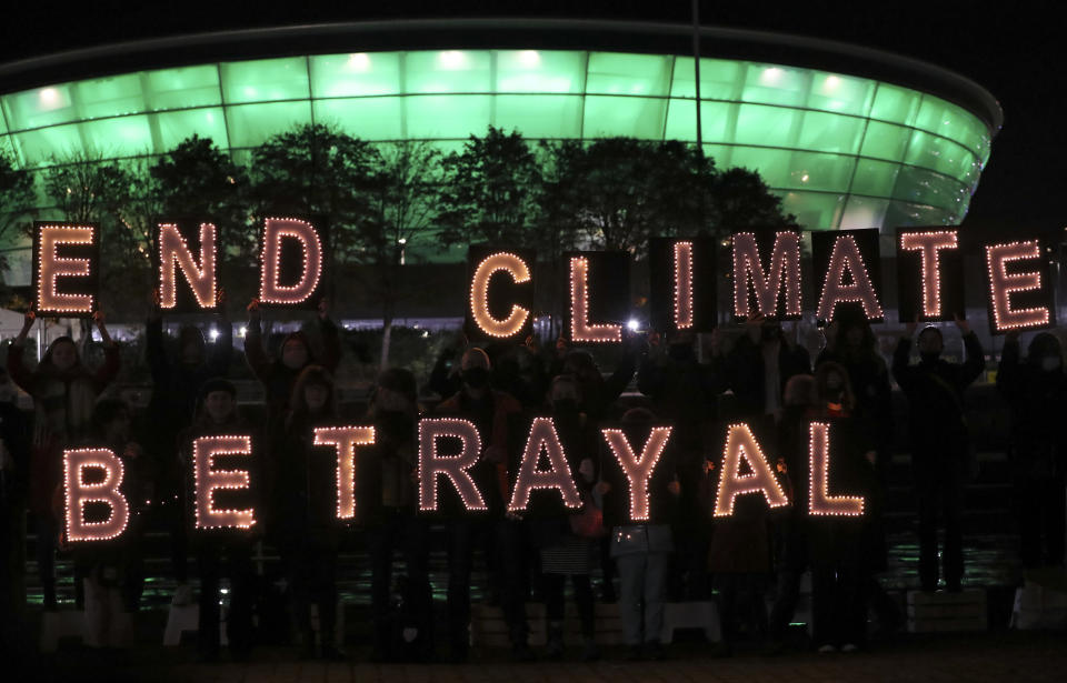 Climate activists protest against Climate Change near the venue of the COP26 U.N. Climate Summit, in Glasgow, Scotland, Tuesday, Nov. 2, 2021. The U.N. climate summit in Glasgow gathers leaders from around the world, in Scotland's biggest city, to lay out their vision for addressing the common challenge of global warming. (AP Photo/Scott Heppell)