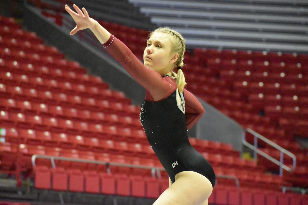 Bloomington North's Sofia Garcia competes on the beam during the IHSAA Gymnastics State Championship on March 12, 2022.