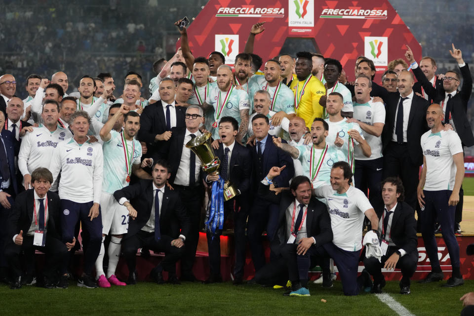 Inter Milan's President Steven Zhang celebrates with the trophy at the end of the Italian Cup final soccer match between Fiorentina and Inter Milan at the Rome's Olympic Stadium, Wednesday, May 24, 2023. (AP Photo/Andrew Medichini)