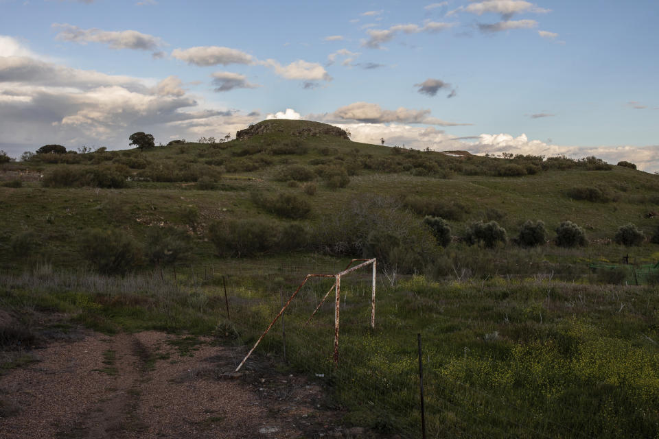 In this April 10, 2019 photo, a fence in-between a rusty goal in the village of La Bienvenida, central Spain. Politicians are swapping campaign buses for tractors, buddying up with hunters and inspecting the tenderness of tomatoes in the otherwise neglected, emptying Spain as they compete for votes in Sunday's general election, perhaps the most contested and polarized in the country's recent history. The April 28 election also comes as Spain's traditional bipartisan politics have crumbled into five main contenders, spurring the race for votes in the overrepresented hinterland, where nearly one third of seats in the parliament's lower house are up for grabs. (AP Photo/Bernat Armangue)