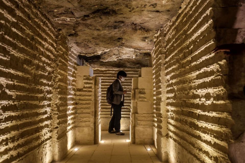 A journalist tours inside the step pyramid of Djoser in Egypt's Saqqara necropolis, south of the capital Cairo, on March 5, 2020.