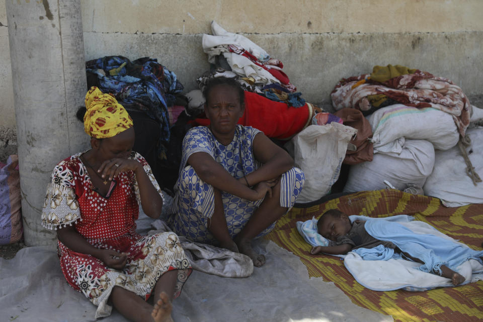 Refugees from the Tigray region of Ethiopia wait to register at the UNCHR center at Hamdayet, Sudan on Saturday, Nov. 14, 2020. Ethiopia’s defiant Tigray regional government has fired rockets at two airports in the neighboring Amhara region as a deadly conflict threatens to spread into other parts of Africa’s second-most populous country. (AP Photo/Marwan Ali)