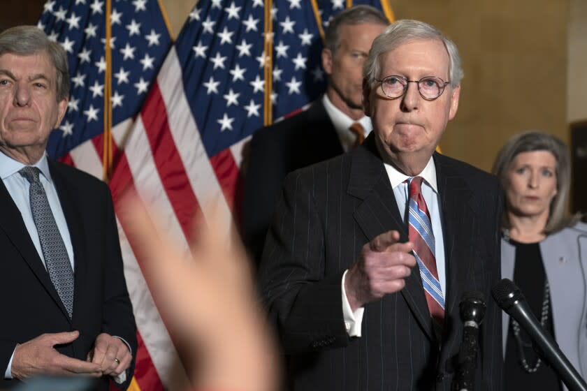Senate Minority Leader Mitch McConnell of Ky., listens as he speaks to reporters on Capitol Hill in Washington, Tuesday, Feb. 8, 2022. (AP Photo/Mariam Zuhaib)