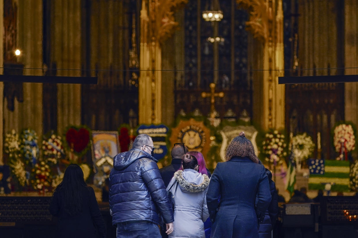 Mourners arrive at St. Patricks Cathedral for the wake of New York City Police Officer Jason Rivera, Thursday, Jan. 27, 2022, in New York. Rivera was fatally shot Friday, Jan. 21, while answering a call about an argument between a woman and her adult son. (AP Photo/Mary Altaffer)