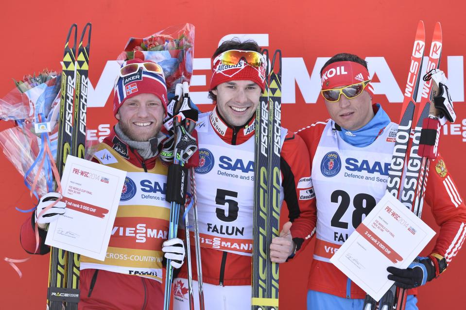 Canada's Alex Harvey, middle, on the winner's stand after the men's FIS World Cup cross country skiathlon race in Falun, Sweden, Saturday March 15, 2014. To the left is runner up Martin Johnsrud Sundby, Norway, and to the right second runner up Alexander Legkov, Russia. (AP photo/ TT, Anders Wiklund) SWEDEN OUT