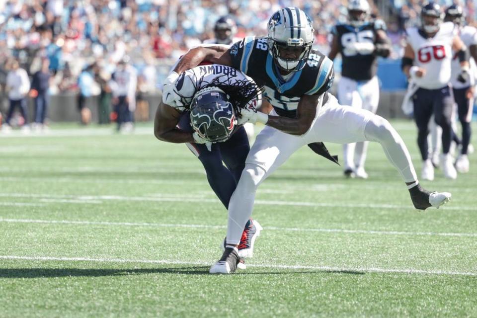 Houston Texans wide receiver Noah Brown, left, is tackled by Carolina Panthers safety Sam Franklin Jr. during the game at Bank of America Stadium on Sunday, October 29, 2023.