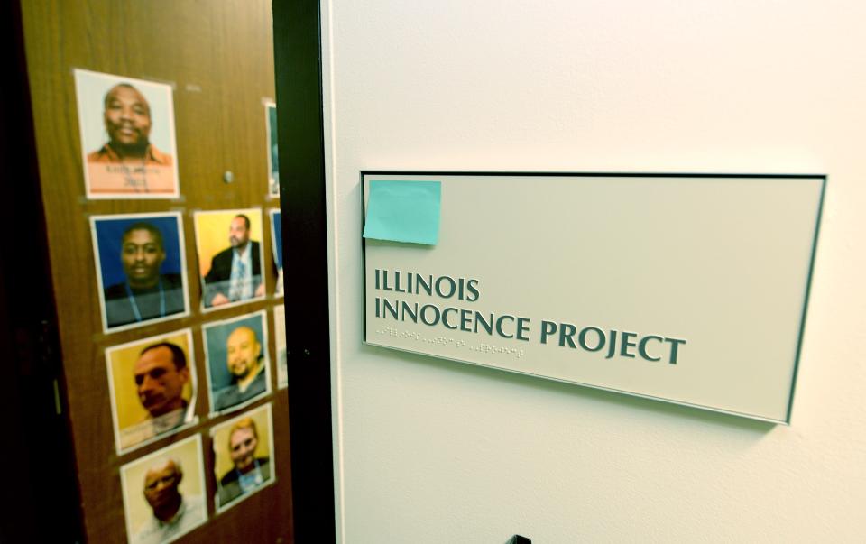 A sign outside the office of the Illinois Innocence Project office at the University of Illinois Springfield is seen Wednesday, March 27, 2024, with photos of some of their clients who were exonerated on the office door.