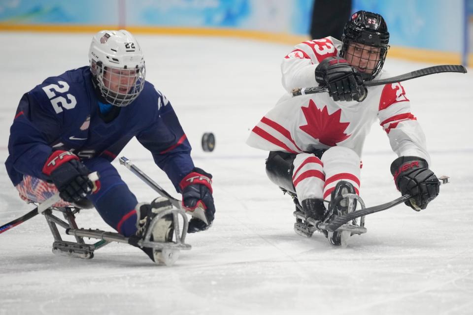 Liam Hickey, right, of Canada scored one goal in a 5-2 loss on Saturday to Noah Grove, left, and the United States in Game 3 of a three-game Para hockey series in Minot, N.D. (Dita Alangkara/AP Photo via The Canadian Press/File - image credit)