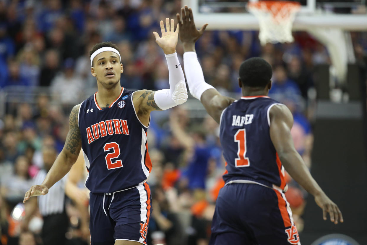 KANSAS CITY, MISSOURI - MARCH 31: Bryce Brown #2 and Jared Harper #1 of the Auburn Tigers react to a play against the Kentucky Wildcats during the 2019 NCAA Basketball Tournament Midwest Regional at Sprint Center on March 31, 2019 in Kansas City, Missouri. (Photo by Christian Petersen/Getty Images)