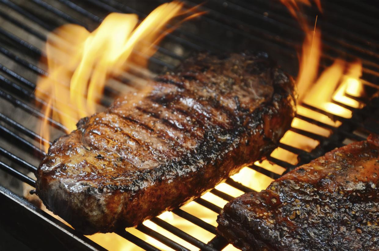 Grilled ribeye steaks on the grill. Close-up. Macro. American cuisine.