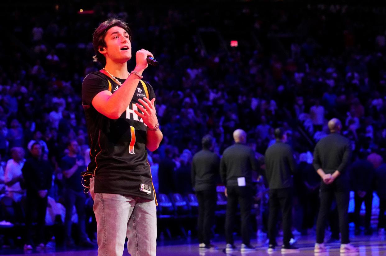 Oct 19, 2022; Phoenix, AZ, USA; Actor Asher Angel sings the national anthem during the Phoenix Suns season opener at Footprint Center. Mandatory Credit: Rob Schumacher-Arizona Republic