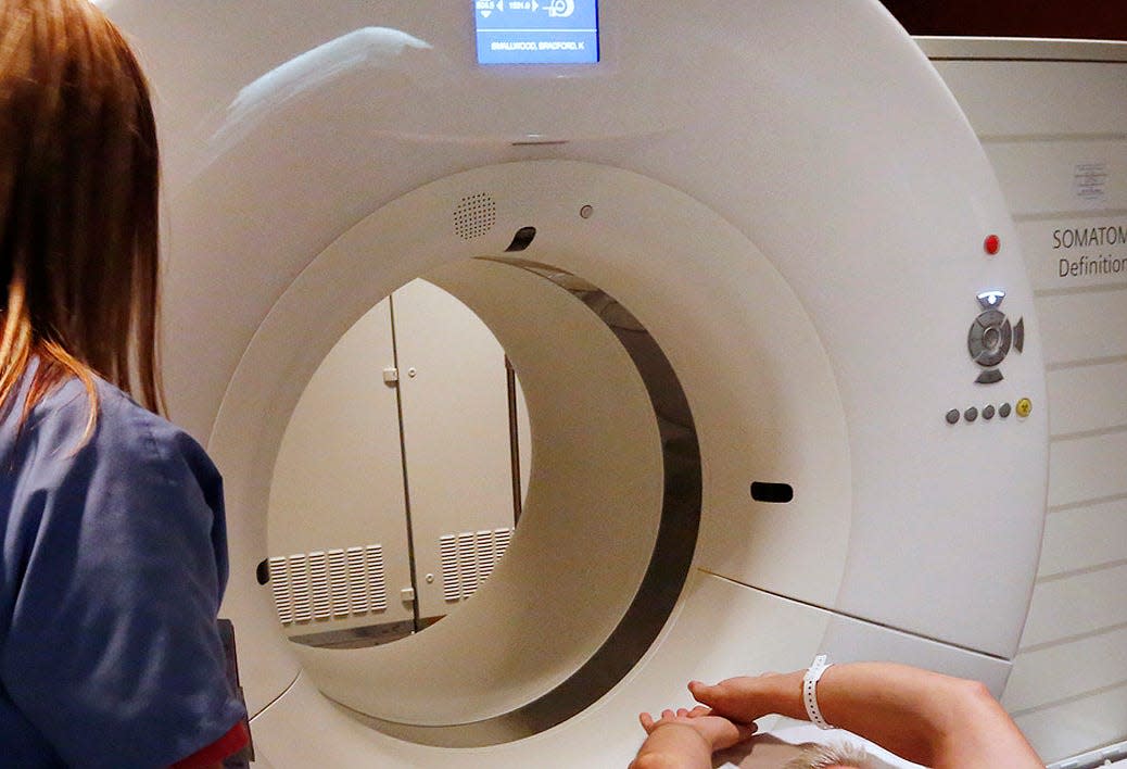 A patient is prepared for a CT scan at Martha Morehouse Medical Plaza on Ohio State University's campus on Oct. 7, 2013.