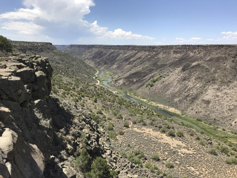 This August 2018 photo shows the Taos Gorge in New Mexico. Hikers have embarked on a 500-mile (805-kilometer) expedition that will traverse New Mexico. The mission: Chart out the best route and identify what challenges might lay ahead as the state moves closer to establishing the Rio Grande Trail. Following in the footsteps of other states, New Mexico is looking to capitalize on its vistas, mild weather and culture with the creation of a long-distance trail along one of North America's longest rivers. (AP Photo/Susan Montoya Bryan)