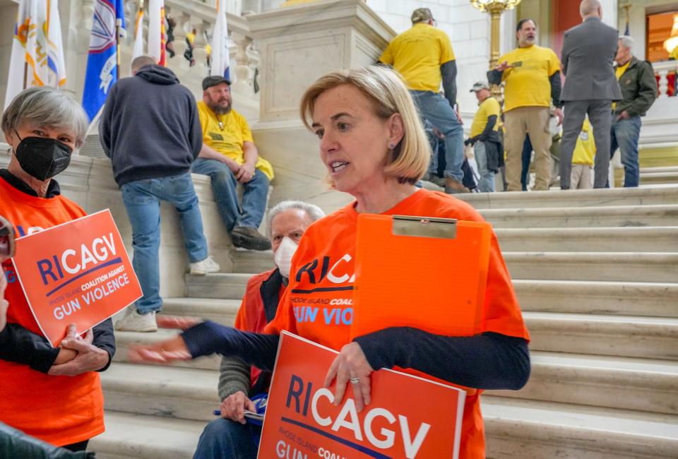 Rhode Island Coalition Against Gun Violence volunteer Audrey Kupchan on the steps of the State House rotunda in March.