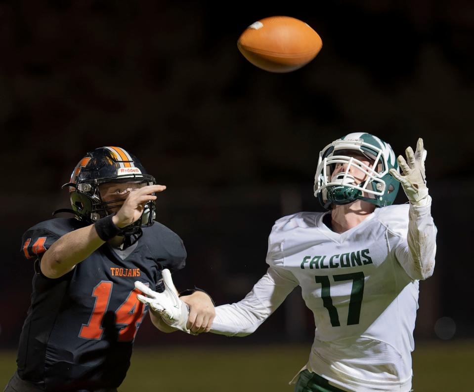 West Burlinghton-Notre Dame's Matthew Booten hauls i a 14-yard pass from Caden Schwenker Friday as Fairfield's Tate Allen defends.