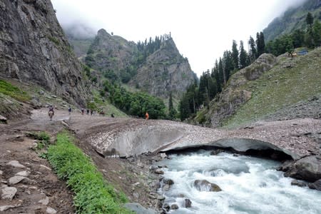 Hindu pilgrims trek through mountains to reach the holy Amarnath cave shrine, near Pahalgam