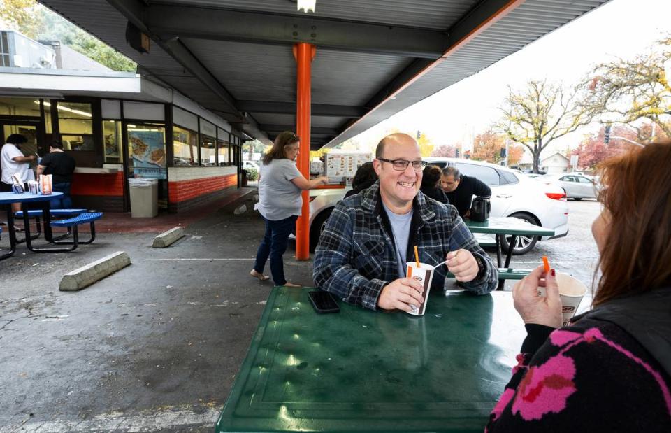 Waterford resident Mike Miller came with friend Cambria Pollinger of Turlock to enjoy one last root beer float at A&W in Modesto, Calif., Friday Nov. 17, 2023. The restaurant is closing after 66 years of continuous service.