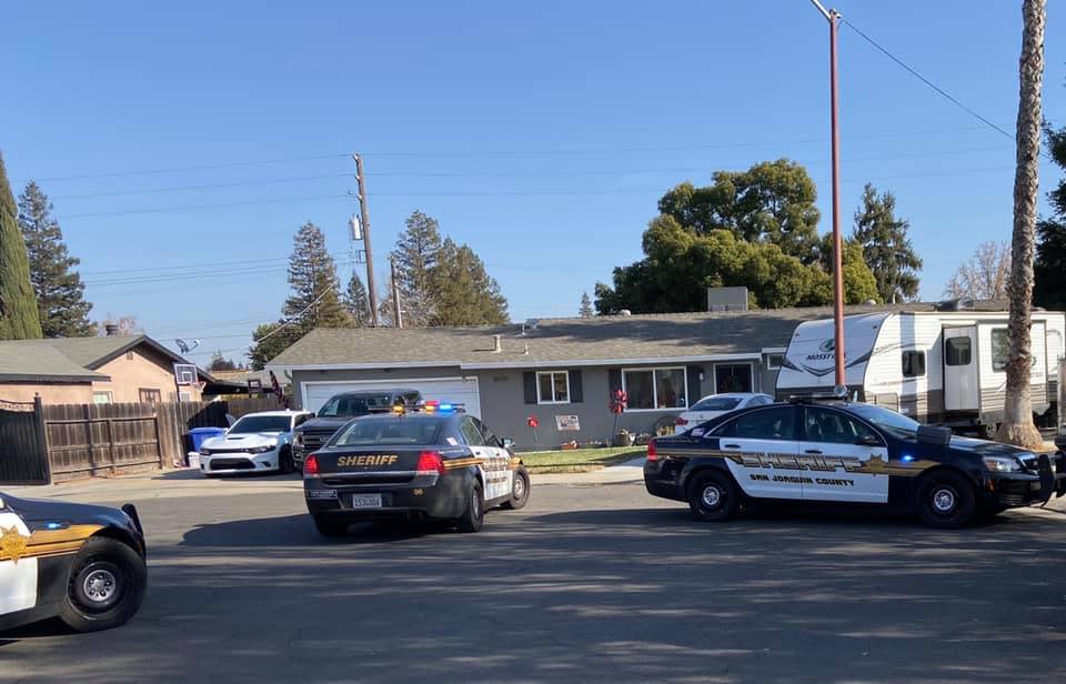 Police outside a home in San Joaquin County in the US state of California where Adam Llanos died by suicide.