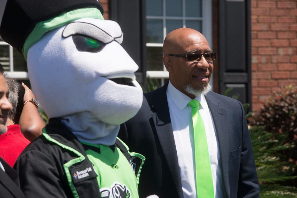 Davy, the Ghost Pirates mascot, left, and Port Wentworth Mayor Pro Tem Thomas Barbee pose for a photo outside Port Wentworth City Hall on Tuesday during an announcement for the Savannah Ghost Pirates training facility, to be located in the city's upcoming recreation complex.