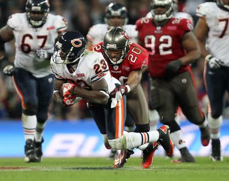 FILE PHOTO: American Football - Tampa Bay Buccaneers v Chicago Bears NFL International Series - Wembley Stadium - 23/10/11 Tampa Bay Buccaneers' Ronde Barber (R) and Chicago Bears' Devin Hester in action Mandatory Credit: Action Images / Matthew Childs Livepic