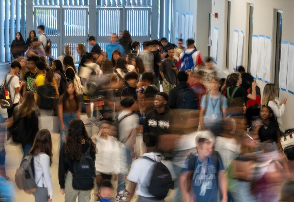 Students arrive for their first day of school at Dr. Joaquin Garcia High School. The school was built to combat crowding at nearby high schools.