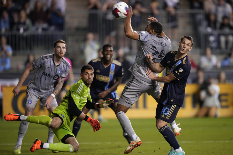 Philadelphia Union's Déniel Gazdag (10) and CF Montréal's George Campbell (24) collide during the second half of an MLS soccer match, Saturday, June 3, 2023, in Chester, Pa. (AP Photo/Matt Slocum)