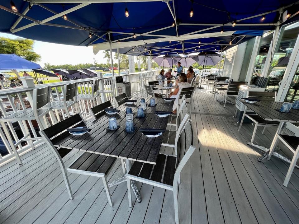 High Tide Social House's shaded front porch overlooks the live music stage.