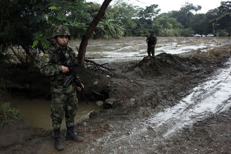 Colombian soldiers stand guard during a military operation at the border with Venezuela in Cucuta, Colombia February 13, 2018. REUTERS/Carlos Eduardo Ramirez