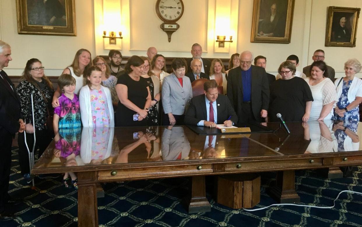Gov. Chris Sununu signs Senate Bill 381, creating a special education watchdog agency in the state, on July 1.