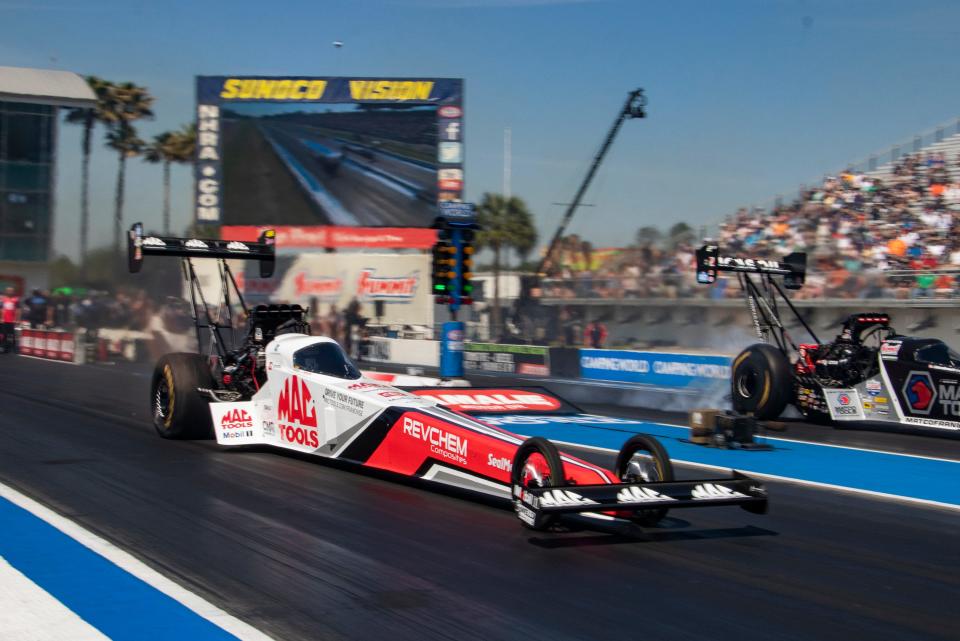 Top Fuel driver Doug Kalitta, left, races Antron Brown during round two of eliminations on March 12, 2023, during the 54th Amalie Motor Oil NHRA Gatornationals at Gainesville Raceway.