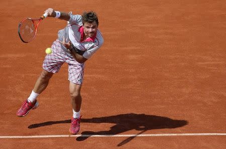 Stan Wawrinka of Switzerland serves to Novak Djokovic of Serbia during their men's final match at the French Open tennis tournament at the Roland Garros stadium in Paris, France, June 7, 2015. REUTERS/Gonzalo Fuentes