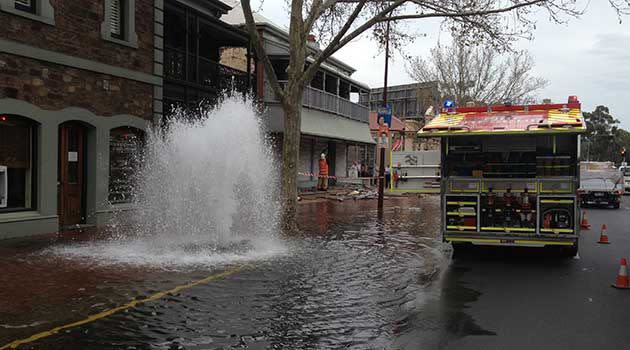 This afternoon's crash left water spewing into O'Connell St. Photo: Matt Gerke, 7News.