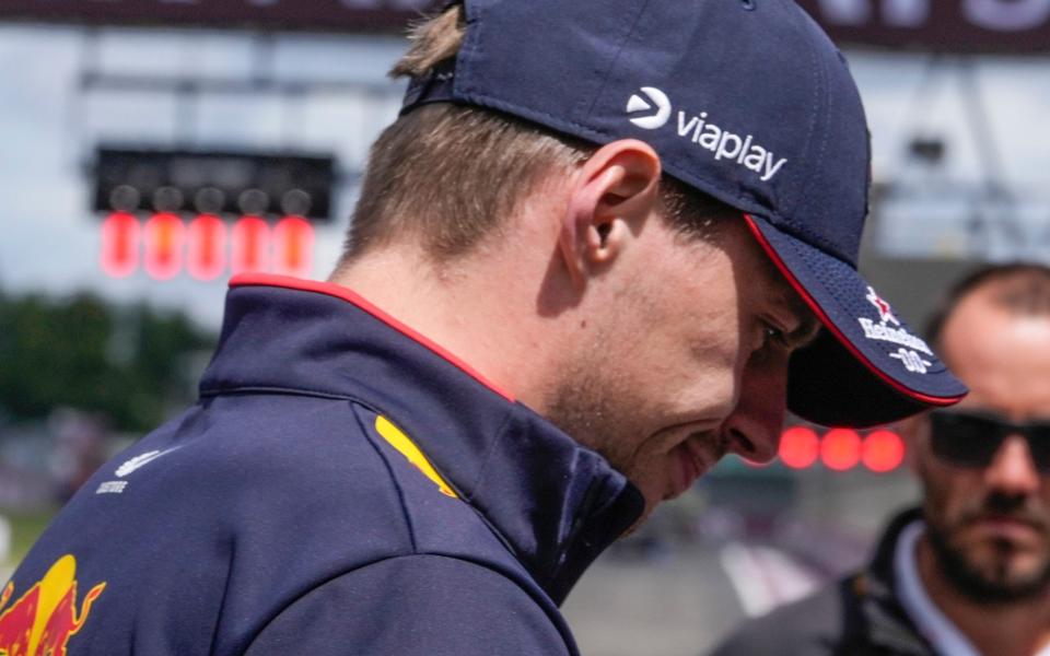 Red Bull driver Max Verstappen of the Netherlands walks on the track after the driver's parade ahead the British Formula One Grand Prix at the Silverstone racetrack, Silverstone, England, Sunday, July 7, 2024.