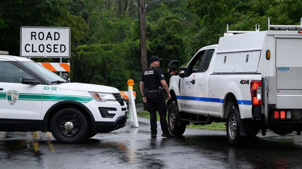 PHOTO: The road in Washington Crossing, Pa., where 11 vehicles were trapped by flash flooding late Saturday afternoon, July 16, 2023. (Kriston Jae Bethel/The New York Times)