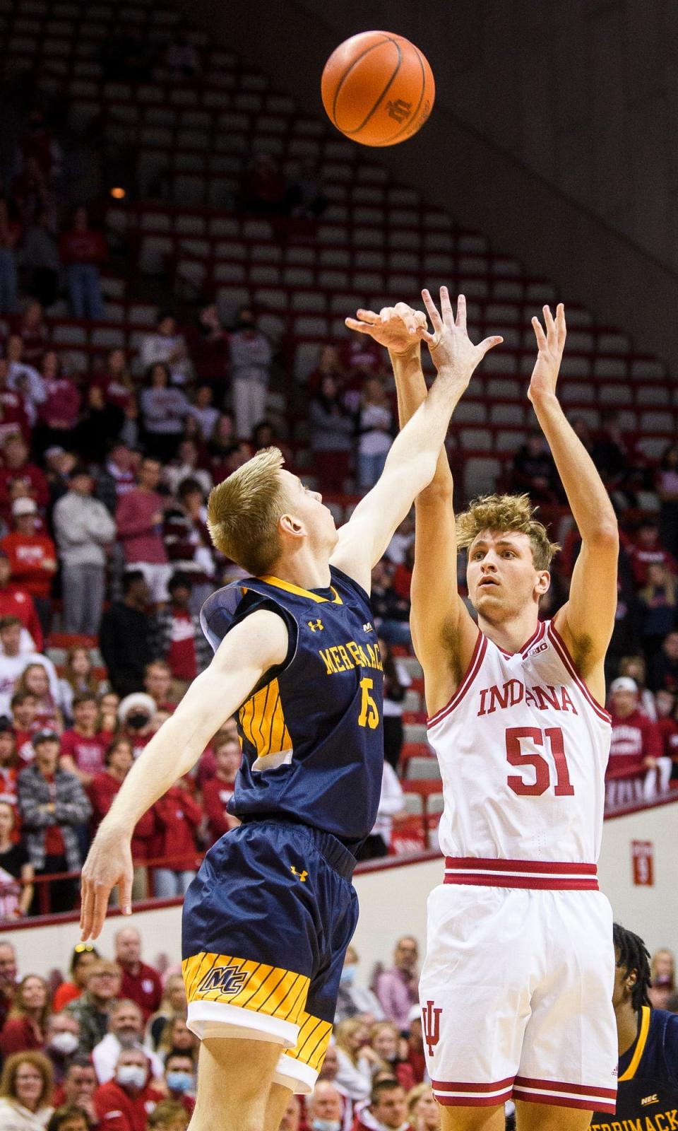 Indiana's Logan Duncomb (51) scores over Merrimack's Ryan Isaacson (15) during the second half of the Indiana versus Merrimack men's basketball game at Simon Skjodt Assembly Hall on Sunday, Dec. 12, 2021.