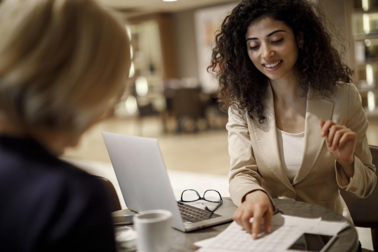 Young business woman working with a customer