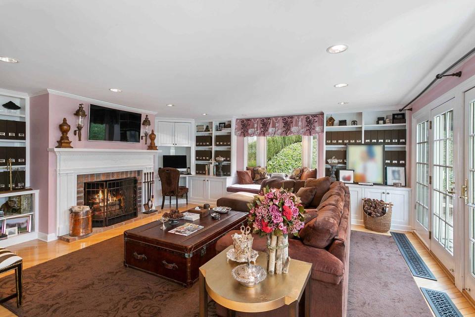 11) The inviting living room features a fireplace and ample seating.