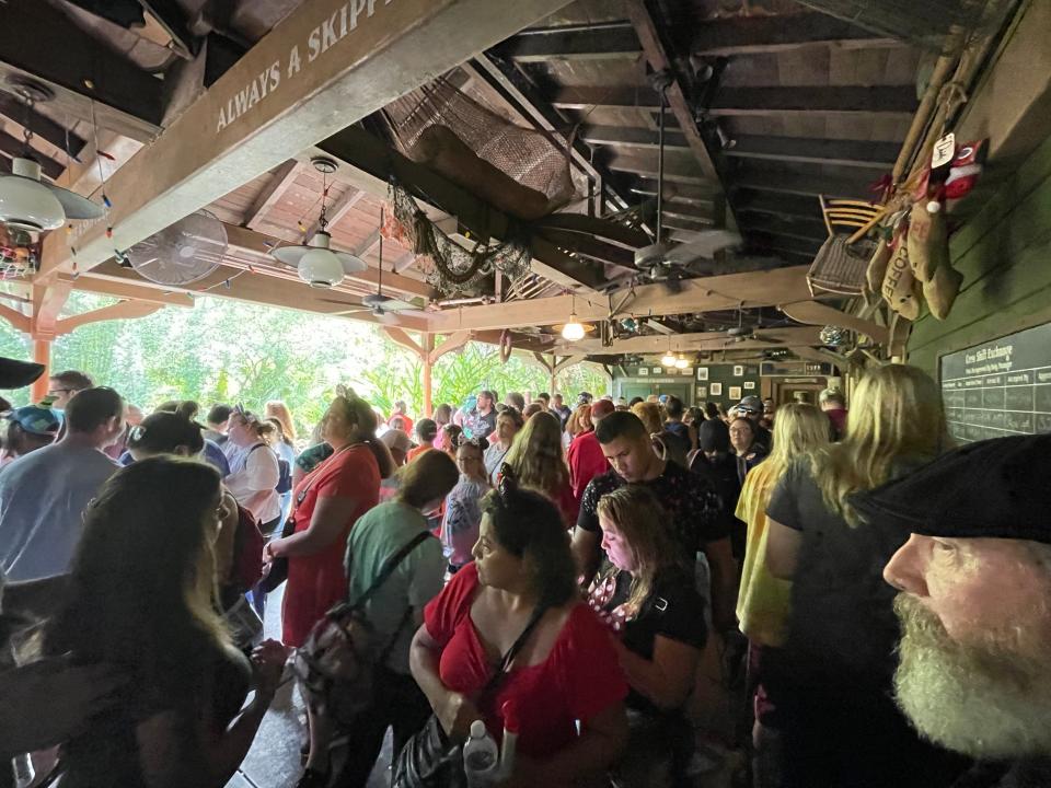 lines of people waiting to ride jingle cruise jungle cruise holiday overlay in magic kingdom