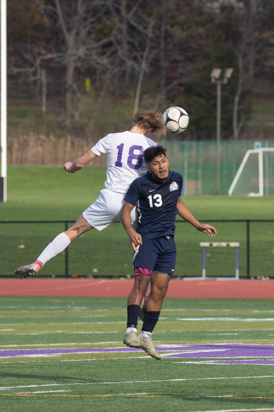 Christian Brother's Aiden Duggan, left, and Beacon's Miguel Ruiz fight for the ball in the New York State Class A soccer semifinals in Monroe on November 12, 2022.