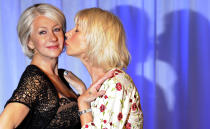 British actress Helen Mirren (R) poses for photographers next to her wax model at Madame Tussauds in London May 11, 2010. REUTERS/Paul Hackett