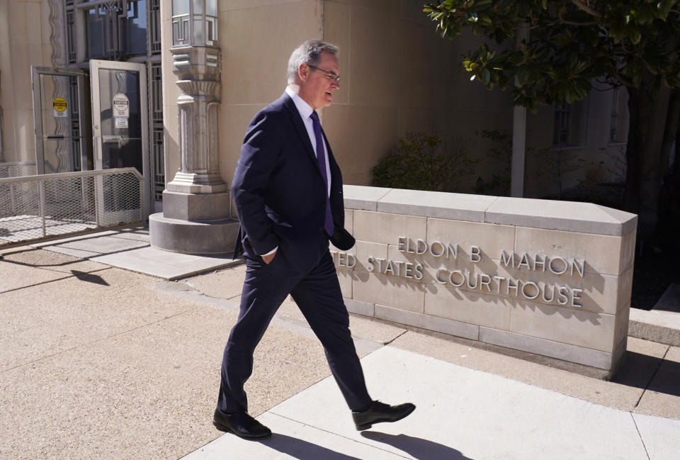 Mike Delaney, chief aerospace safety officer at the Boeing Company, walks from the federal court building after the arraignment of Boeing in Fort Worth, Texas, Thursday, Jan. 26, 2023. Boeing representatives and relatives of some of the passengers killed in two crashes of Boeing 737 Max jets met face-to-face in a Texas courtroom Thursday, where the aerospace giant was arraigned on a criminal charge that it thought it had settled two years ago. (AP Photo/LM Otero)