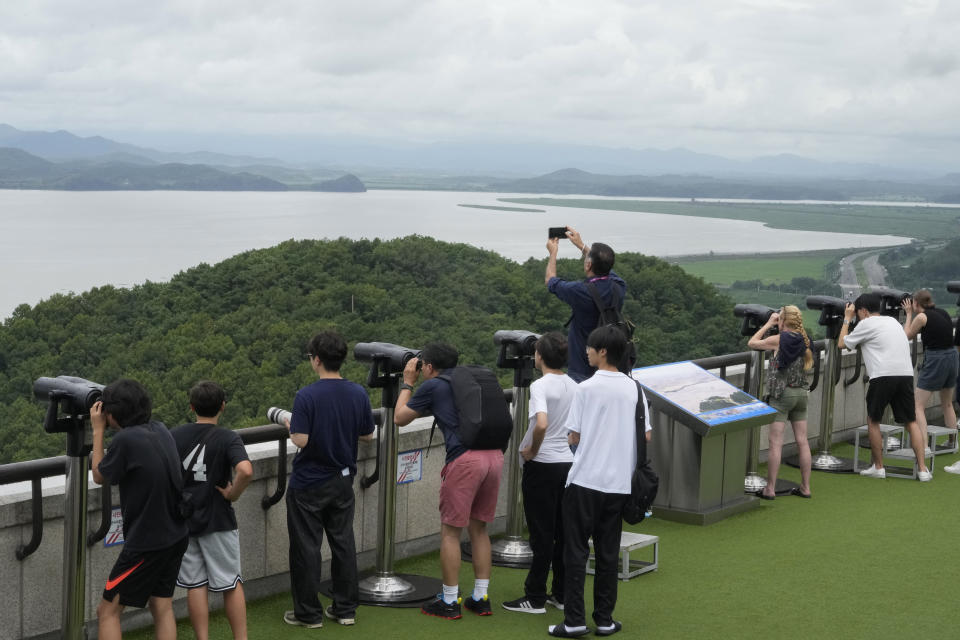 Visitors watch the North Korea side from the Unification Observation Post in Paju, South Korea, near the border with North Korea, Wednesday, July 24, 2024. (AP Photo/Ahn Young-joon)