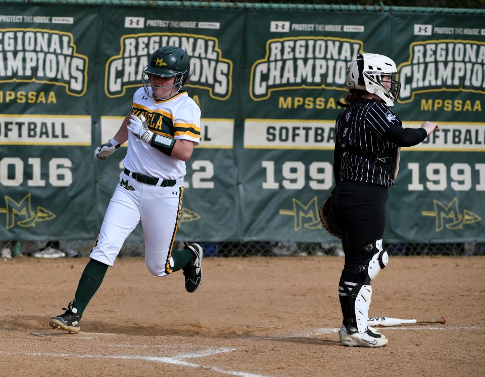 Mardela's Hayden Adkins (3) scores against St. Michael's Thursday, March 21, 2024, in Mardela Springs, Maryland. Mardela defeated St. Michael's 19-0.