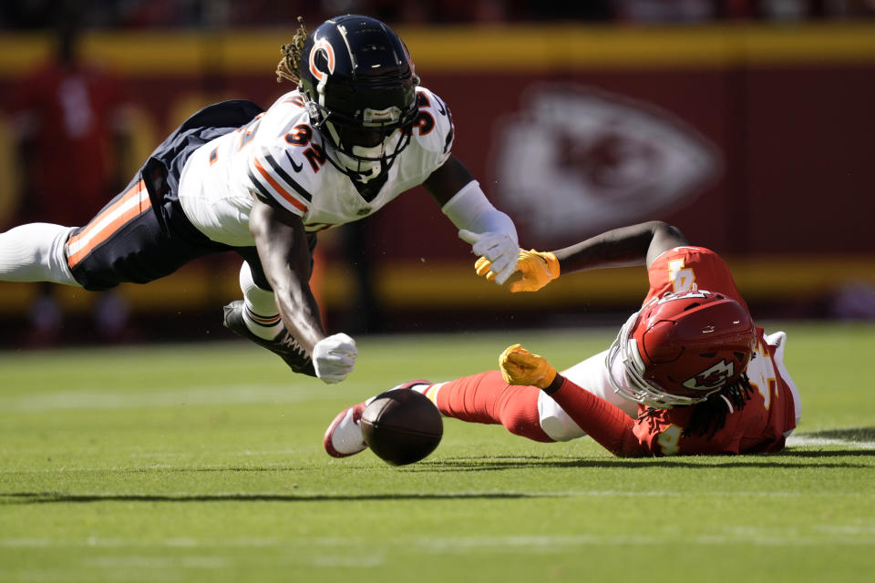 Kansas City Chiefs wide receiver Rashee Rice (4) is unable to catch a pass as Chicago Bears cornerback Terell Smith (32) defends during the first half of an NFL football game Sunday, Sept. 24, 2023, in Kansas City, Mo. (AP Photo/Charlie Riedel)