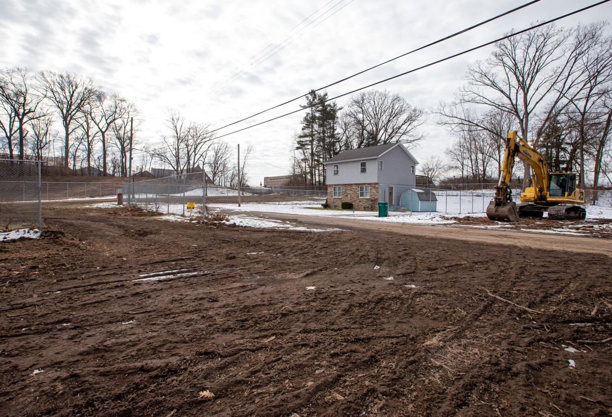 Lots have been cleared, with the exception of one home, along Palmer Street, near Notre Dame, on Tuesday, Jan. 18, 2022, in South Bend. 