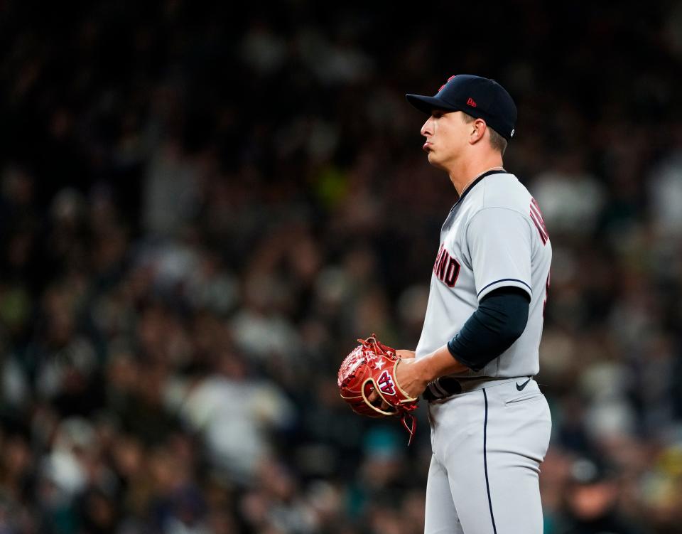 Cleveland Guardians relief pitcher James Karinchak reacts after being called for a pitch-clock violation during the eighth inning against the Seattle Mariners on Thursday, March 30, in Seattle.