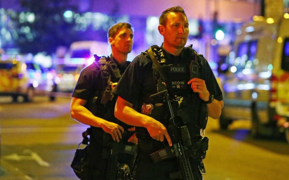 Armed police officers attend to the scene after a vehicle collided with pedestrians in the Finsbury Park - Credit: Reuters